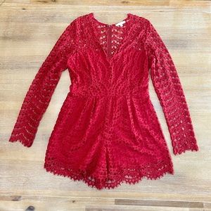 Red lace romper with long sleeves size Large